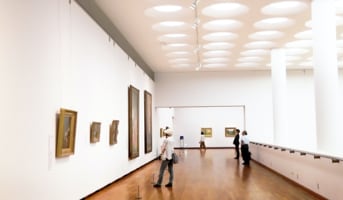 Spacious art gallery hall with displayed artworks